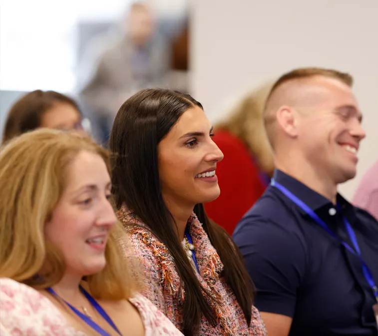 Employees engaging in a group session at Amylyx' company-wide meeting.