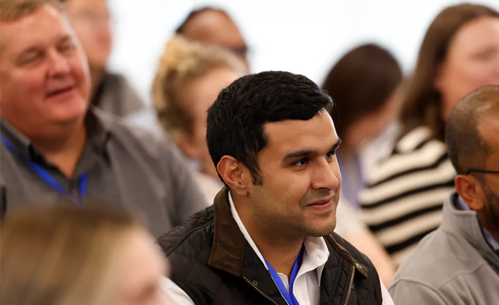 Employees engaging in a group session at Amylyx' company-wide meeting.